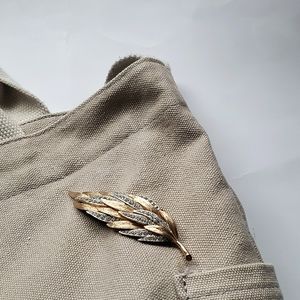 Gold feather brooch with matching earrings